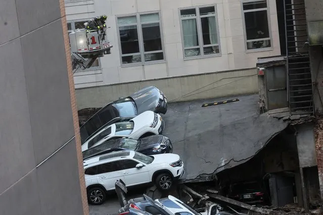 Cars and debris are piled after a parking garage collapsed in the Manhattan borough of New York City, U.S., April 18, 2023. (Photo by Brendan McDermid/Reuters)