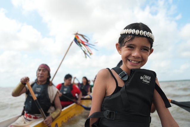 Moana Mason, 8, participates in the People's Summit event on Guajara Bay during the COP30 U.N. Climate Summit, Wednesday, November 12, 2025, in Belem, Brazil. (Photo by Joshua A. Bickel/AP Photo)