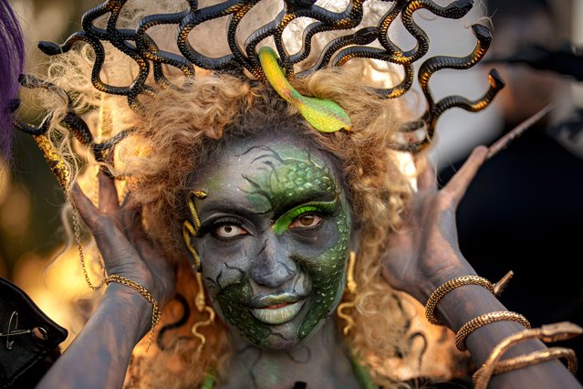 A model wear a Halloween themed costume during a parade at the West Side Hallo Fest, a Halloween festival in Bucharest, Romania, Saturday, October 26, 2024. (Photo by Andreea Alexandru/AP Photo)