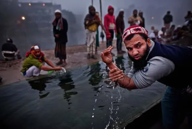 Muslim devotees wash on the last day of the annual Bishwa Ijtema on January 18, 2015 in Tongi, Bangladesh. The Bishwa Ijtema is the second largest gathering of Muslims in the world, after the Hajj, and is organized by World Tablig Council, which preaches teachings of Islam and prophet Mohammad. (Photo by Allison Joyce/Getty Images)