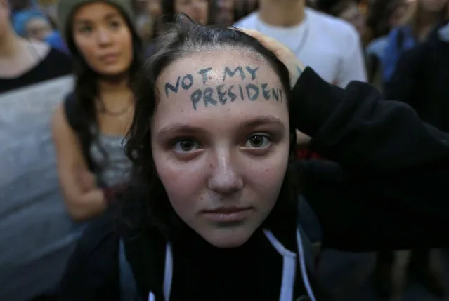 Clair Sheehan has the words “Not My President” written on her forehead as she takes part in a protest against the election of President-elect Donald Trump, Wednesday, Nov. 9, 2016, in downtown Seattle. (Photo by Ted S. Warren/AP Photo)