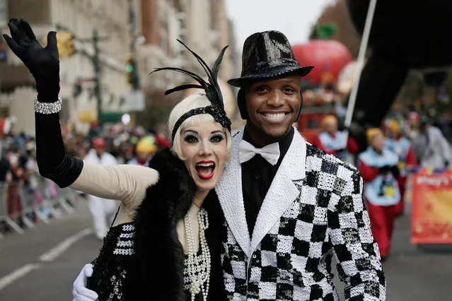 Dancers perform in the Macy's 90th Annual Thanksgiving Day Parade in New York, New York, USA, 24 November 2016. The annual parade, which began in 1924, features giant balloons of characters from popular culture floating above the streets of Manhattan. (Photo by Peter Foley/EPA)