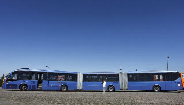 A view of what the Curitiba City Hall is calling the world's longest articulated bus, as it was presented to the press before going into service on the city's public transportation grid, in Curitiba April 5, 2011. The bus, made in Brazil by Volvo with a Neobus chassis, has a capacity of 250 passengers, is 28 meters (92 ft) long, 2.6 meters (8.5 ft) wide, and powered with biodiesel made from soybeans. (Photo by Rodolfo Buhrer/Reuters)