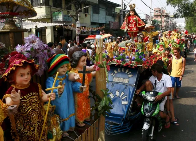 Devotees parade different Sto. Nino (infant Jesus) replicas during a procession in Manila January 16, 2016, a day before the annual of the feast day of Sto. Nino on Sunday. (Photo by Romeo Ranoco/Reuters)