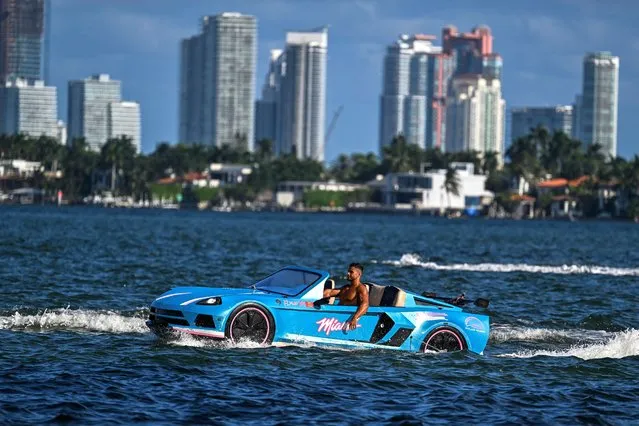 A man drives a modified boat “Jetcar” in the bay in Miami, Florida, on October 4, 2023. (Photo by Chandan Khanna/AFP Photo)