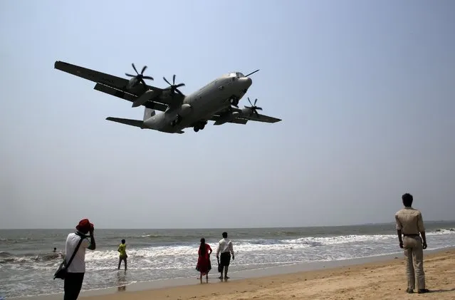 Indian Air Force's Hercules C-130J, prepares to land at the Juhu strip on the Arabian Sea coast as part of a terror preparedness exercise in Mumbai, India, Tuesday, March 24, 2015. (Photo by Rajanish Kakade/AP Photo)