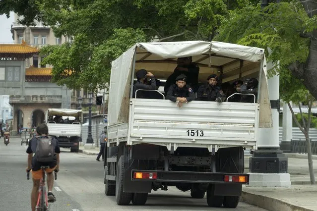 A truck of special forces police sits parked outside National Capitol building in Havana, Cuba, Wednesday, July 14, 2021, days after protests. Demonstrators voiced grievances on Sunday against goods shortages, rising prices and power cuts, and some called for a change of government. (Photo by Eliana Aponte/AP Photo)