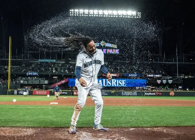Seattle Mariners shortstop J.P. Crawford celebrates after he had a bucket of water dumped on him following a walk-off win against the Texas Rangers on Thursday, September 28, 2023. (Photo by Stephen Brashear/USA Today via Reuters)