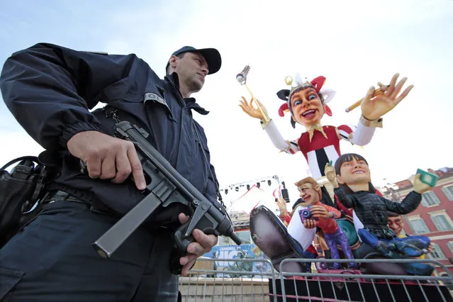 A police officer stands near the float of the King of Carnival as part of the “Vigipirate” security plan following Paris' deadly attacks in Nice, France, February 15, 2016. (Photo by Eric Gaillard/Reuters)
