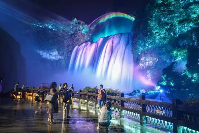 Huangguoshu Waterfall is seen during a 3D projection light show on August 18, 2021 in Anshun, Guizhou Province of China. (Photo by Qu Honglun/China News Service via Getty Images)