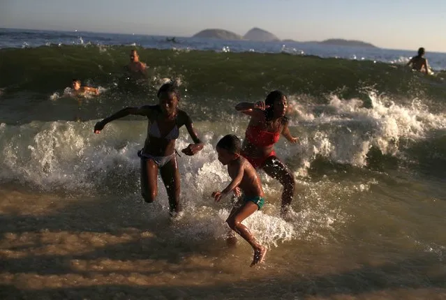 People enjoy the waters of Ipanema beach in Rio de Janeiro, Brazil January 11, 2019. (Photo by Pilar Olivares/Reuters)