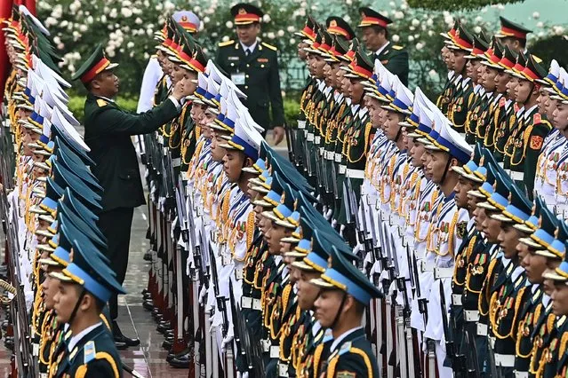 Vietnamese honour guards prepare for the welcoming ceremony for Cambodia's Prime Minister Hun Manet at the Presidential Palace in Hanoi on December 11, 2023. (Photo by Nhac Nguyen/AFP Photo)