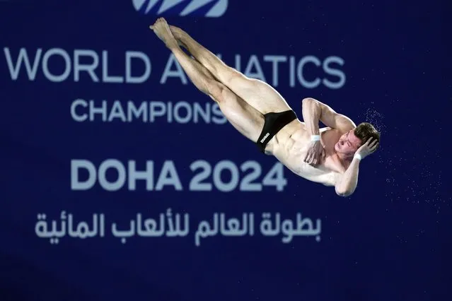 Yevhen Naumenko of Ukraine competes during the men's 10m platform diving preliminary at the World Aquatics Championships in Doha, Qatar, Friday, February 9, 2024. (Photo by Hassan Ammar/AP Photo)
