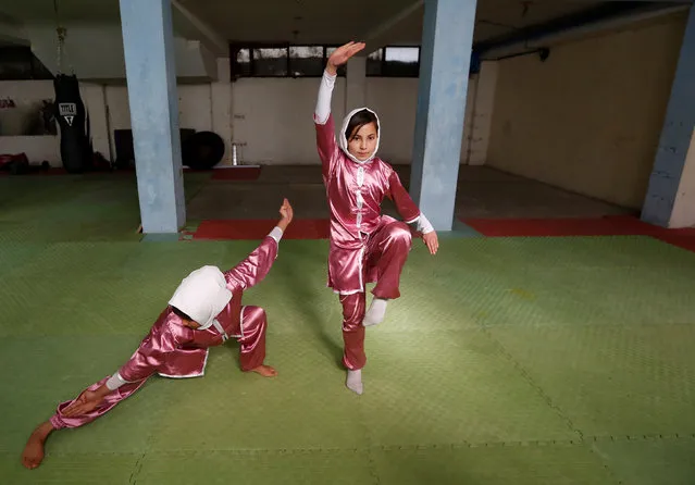 Mena Azimi (R), 15, practices at the Shaolin Wushu club in Kabul, Afghanistan January 19, 2017. (Photo by Mohammad Ismail/Reuters)