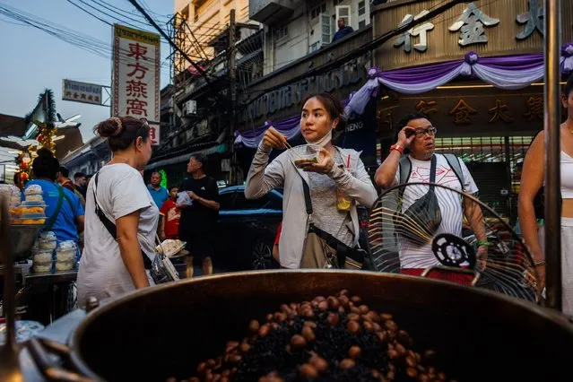People eat street food in Chinatown on Lunar New Years Eve on February 09, 2024 in Bangkok, Thailand. (Photo by Lauren DeCicca/Getty Images)