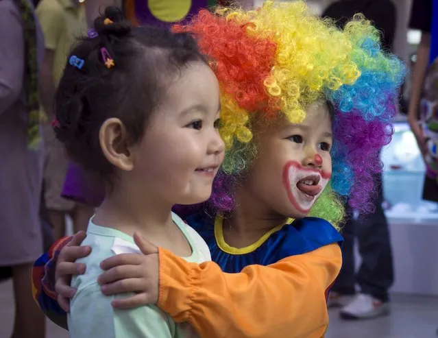 Children play during the Day of Clown festival in Almaty, Kazakhstan, April 24, 2015. (Photo by Shamil Zhumatov/Reuters)