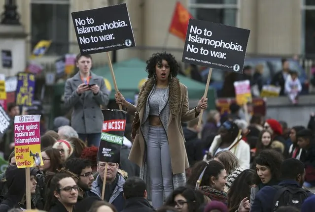 Demonstrators hold placards during a refugees welcome march in London, Britain March 19, 2016. (Photo by Neil Hall/Reuters)