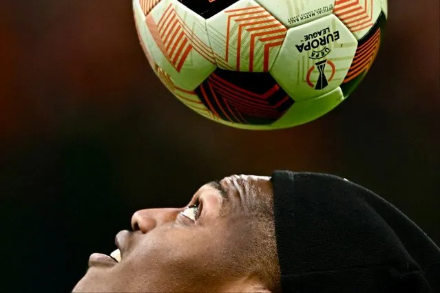 AC Milan's Portuguese forward #10 Rafael Leao looks the ball during the warm up before the UEFA Europa League match, Round of 16, 1st leg, between AC Milan and SK Slavia Prague at the San Siro Stadium in Milan on March 7, 2024. (Photo by Gabriel Bouys/AFP Photo)