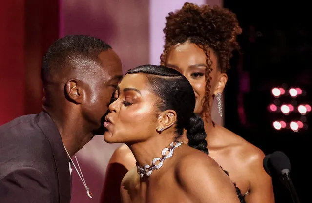 American actor Sterling K. Brown kisses American actress Taraji P. Henson on her cheek as he presents the award for Outstanding Supporting Actress in a Motion Picture along with Ryan Michelle Bathe onstage during the 55th NAACP Image Awards at Shrine Auditorium and Expo Hall on March 16, 2024 in Los Angeles, California. (Photo by Mario Anzuoni/Reuters)