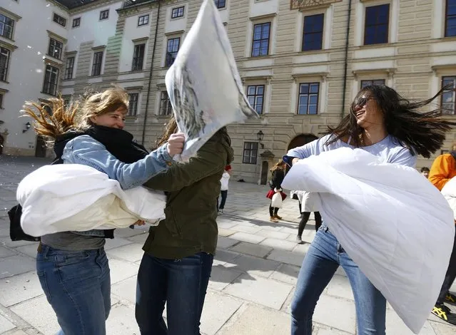 People fight with pillows during World Pillow Fight Day in Vienna, Austria, April 2, 2016. (Photo by Leonhard Foeger/Reuters)