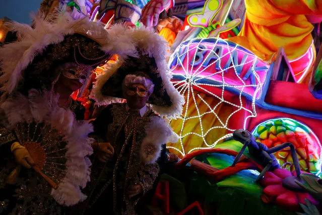 Revellers wearing costumes pose in front of a carnival float during the carnival street parade in Valletta, Malta, February 25, 2017. (Photo by Darrin Zammit Lupi/Reuters)