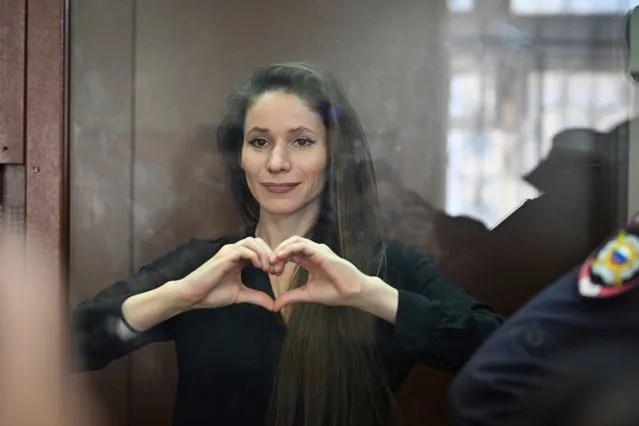 Antonina Favorskaya stands in a glass cage in a courtroom in the Basmanny District Court in Moscow, Russia, Friday, March 29, 2024. A court in Moscow makes a decision on measure of restrain to journalist Antonina Favorskaya in the case of her connection with the FBK, the Anti-Corruption Foundation set up by Russian opposition leader Alexei Navalny in 2011 and declared extremist and closed in 2021. (Photo by Dmitry Serebryakov/AP Photo)