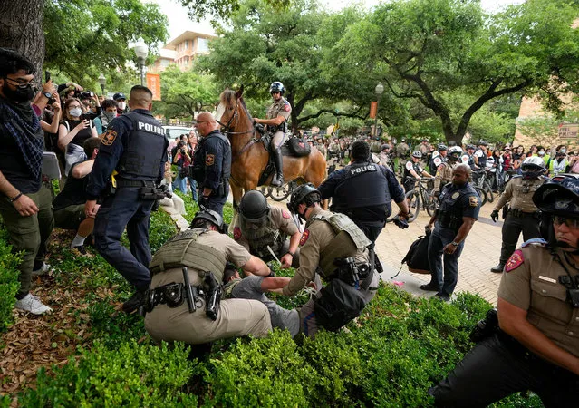 Texas state troopers arrest a man at a pro-Palestinian protest at the University of Texas, during the ongoing conflict between Israel and the Palestinian Islamist group Hamas, in Austin, Texas, April 24, 2024. (Photo by Jay Janner/USA Today Network via Reuters)