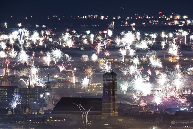 New Year's fireworks are launched in Munich, Germany, on Sunday, January 1, 2023. (Photo by Lennart Preiss/dpa via AP Photo)