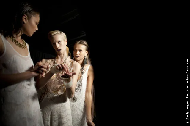 Models prepare backstage before a fashion show by Israeli designer Yossef during the Tel Aviv Fashion Week