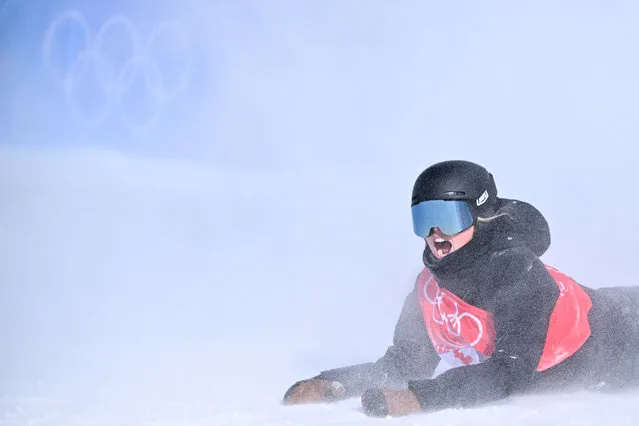 New Zealand's Zoi Sadowski Synnott reacts after her final attempt in the snowboard women's slopestyle final run during the Beijing 2022 Winter Olympic Games at the Genting Snow Park H & S Stadium in Zhangjiakou on February 6, 2022. (Photo by Ben Stansall/AFP Photo)