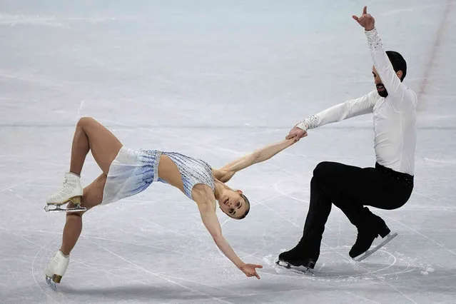Ashley Cain-Gribble and Timothy Leduc, of the United States, compete in the pairs short program during the figure skating competition at the 2022 Winter Olympics, Friday, February 18, 2022, in Beijing. (Photo by David J. Phillip/AP Photo)