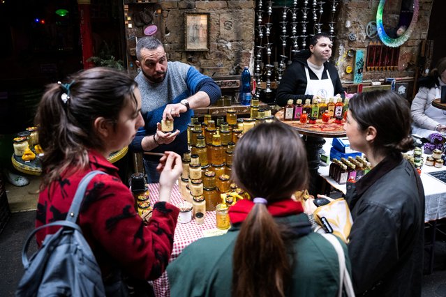 Beekeeper Krisztian Kisjuhasz, 41, sells his honey at a market in Budapest, Hungary, on March 10, 2024. (Photo by Marton Monus/Reuters)