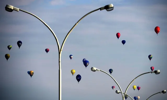 Balloons at the start of the 15th International Mountain Balloon Race in Krosno, southern Poland, 01 May 2014. The Krosno International Mountain Balloon Competition will see almost 40 teams from Poland, Hungary, Lithuania and Slovakia compete. (Photo by Darek Delmanowicz/EPA)