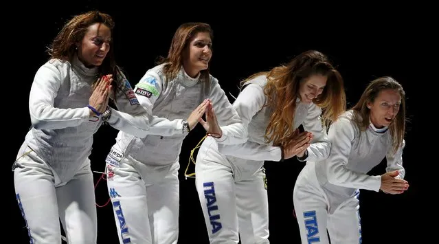 Italy's Elisa Di Francisca, Arianna Errigo, Martina Batini and Valentina Vezzali (L-R) greet Russia's team before their women's team foil final at the World Fencing Championships in Moscow, Russia, July 19, 2015. (Photo by Grigory Dukor/Reuters)