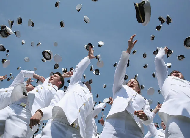 Naval Academy graduates toss their hats in the air during graduation ceremonies at the U.S. Naval Academy May 27, 2016 in Annapolis, Maryland. This is the first year that females wore the same uniform as the males. U.S. Secretary of Defense Ashton Carter was this year's commencement speaker. (Photo by Mark Wilson/Getty Images)