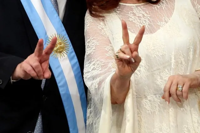 Argentina's President Alberto Fernandez and Vice President Cristina Fernandez de Kirchner flash V-signs after they were sworn in, in Buenos Aires, Argentina on December 10, 2019. (Photo by Agustin Marcarian/Reuters)