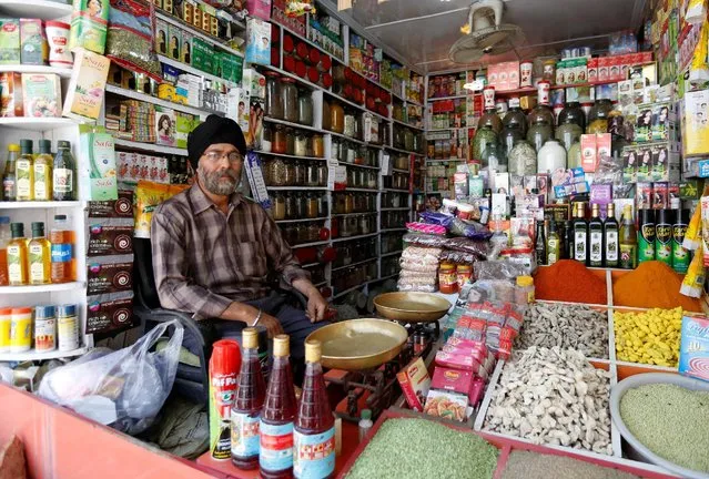 Afghan Sikh Jagtar Singh Laghmani, 50, sits at his traditional herb shop in Kabul, Afghanistan June 19, 2016. (Photo by Mohammad Ismail/Reuters)