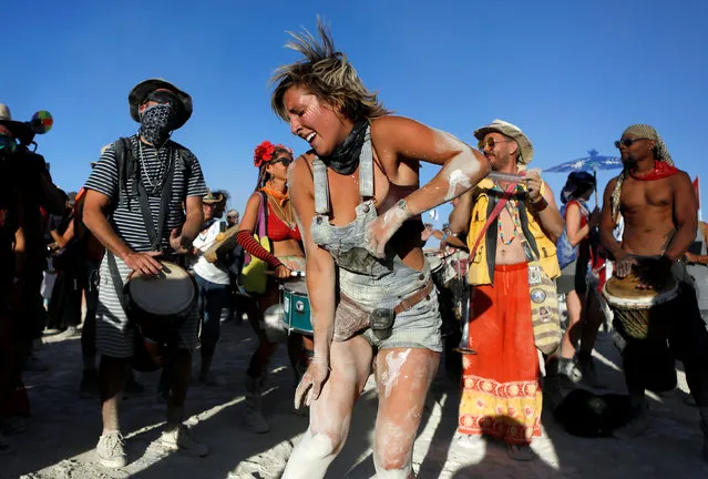 A participant dances as approximately 70,000 people from all over the world gathered for the annual Burning Man arts and music festival in the Black Rock Desert of Nevada, U.S. August 29, 2017. (Photo by Jim Urquhart/Reuters)