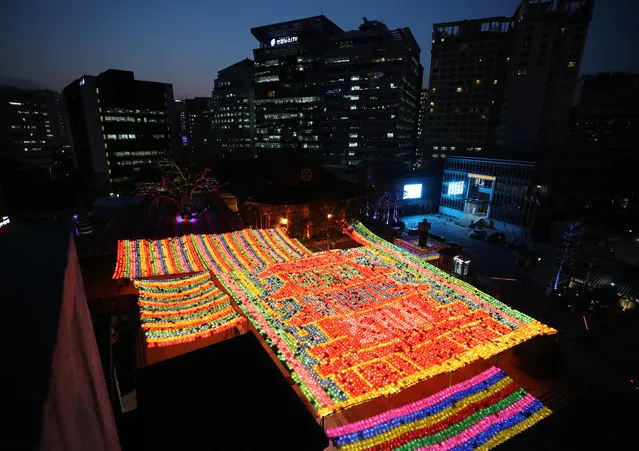 Lanterns light up the ground of Jogye Temple in downtown Seoul, South Korea, 24 March 2020. The lanterns are lit as part of the Buddha's Birthday celebration that falls on April 30 this year. The temple is the main office of the Jogye Order, the largest Buddhist sect in South Korea. (Photo by Yonhap/EPA/EFE)