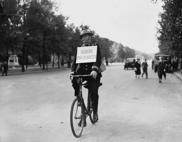 A policeman cycles through London's streets with the raiders passed notice, on September 3, 1939, after the first raid warning of the war. (Photo by AP Photo)