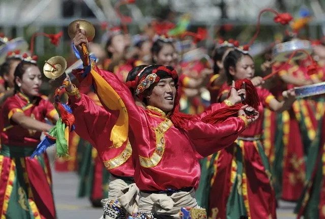 Performers dance during the celebration event at the Potala Palace marking the 50th anniversary of the founding of the Tibet Autonomous Region, in Lhasa, Tibet Autonomous Region, China, September 8, 2015. (Photo by Reuters/China Daily)