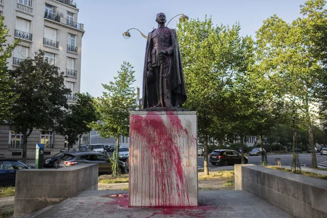 The statue of Hubert Lyautey, who served in Morocco, Algeria, Madagascar and Indochina when they were under French control, is offered with red painting Monday, June 22, 2020. Two statues related to France's colonial era were covered in graffiti Monday amid a global movement to take down monuments to figures tied to slavery or colonialism. (Photo by Rafael Yaghobzadeh/AP Photo)
