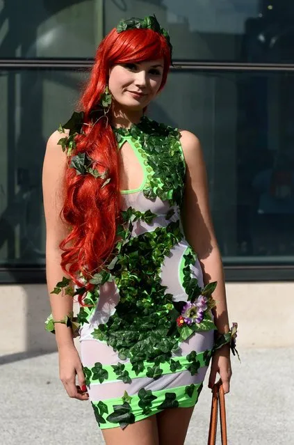 A fan in costume poses upon arrival for the opening day of the 2014 New York Comic Con at the Jacob Javits Center, October 9, 2014, in New York City. (Photo by Timothy A. Clary/AFP Photo)