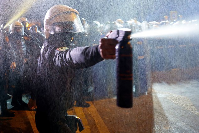 A police officer uses crowd control spray to disperse demonstrators during a protest against the detention of Istanbul Mayor Ekrem Imamoglu, in Istanbul, Turkey, on March 22, 2025. (Photo by Murad Sezer/Reuters)