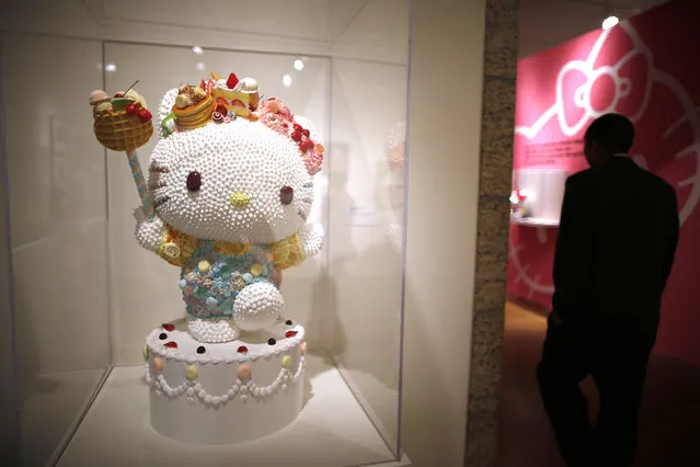 People view “Sweet Kitty” by Osamu Watanabe at the “Hello! Exploring the Supercute World of Hello Kitty” museum exhibit in honor of Hello Kitty's 40th anniversary, at the Japanese American National Museum in Los Angeles, California October 10, 2014. (Photo by Lucy Nicholson/Reuters)