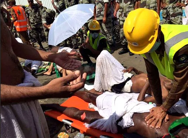 In this image posted on the official Twitter account of the directorate of the Saudi Civil Defense agency, a pilgrim is treated by a medic after a stampede that killed and injured pilgrims in the holy city of Mina during the annual hajj pilgrimage on Thursday, September 24, 2015. (Photo by Directorate of the Saudi Civil Defense agency via AP Photo)