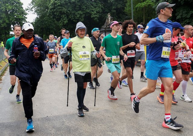 Eldest runner Rene Pairon (C), 96, who never missed a race since its creation in 1980, takes part in the 45th edition of the 20 km of Brussels road race in Brussels on May 25, 2025. The 20 km of Brussels draw over 45 000 participants. (Photo by Virginie Lefour/Belga via AFP Photo)