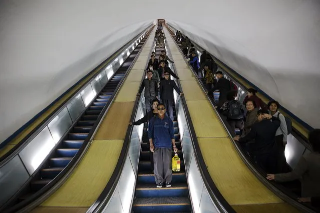 Passengers enter a subway station visited by foreign reporters during a government organised tour in Pyongyang, North Korea October 9, 2015. (Photo by Damir Sagolj/Reuters)