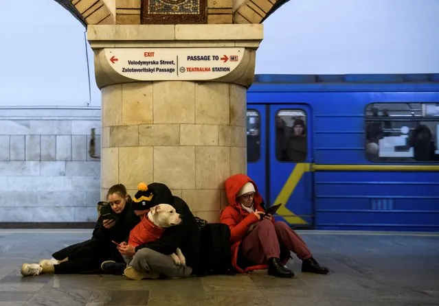 People take shelter inside a metro station during massive Russian missile attacks in Kyiv, Ukraine on December 29, 2022. (Photo by Vladyslav Musiienko/Reuters)
