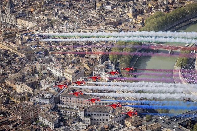 Jets from the United Kingdom's Royal Air Force Aerobatic Team, the Red Arrows, bottom, and the Italian Frecce Tricolori acrobatic squad perform a flypast over Rome to mark the state visit of Britain's King Charles III and Queen Camilla, Tuesday, April 8, 2025. (Photo by Iwan Lewis/RAF, Ministry of Defence via AP Photo)